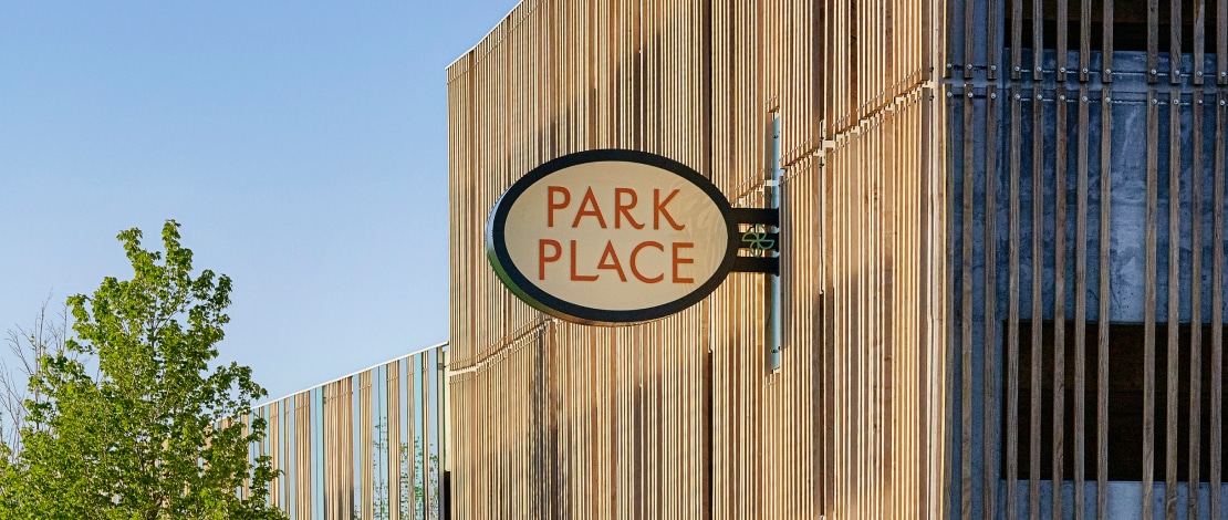 a sign on the side of a building that says park place.