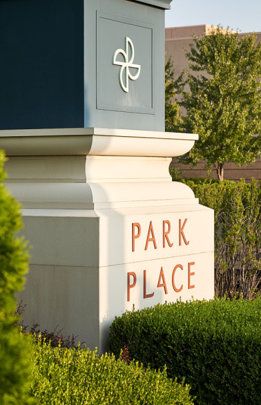 a sign that says park place in front of a building.